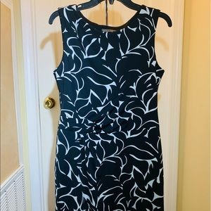 Black sleeveless shift dress with faux side tie. Fully lined  Size 8